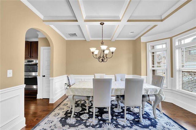 dining room featuring plenty of natural light, arched walkways, coffered ceiling, and dark wood-style flooring