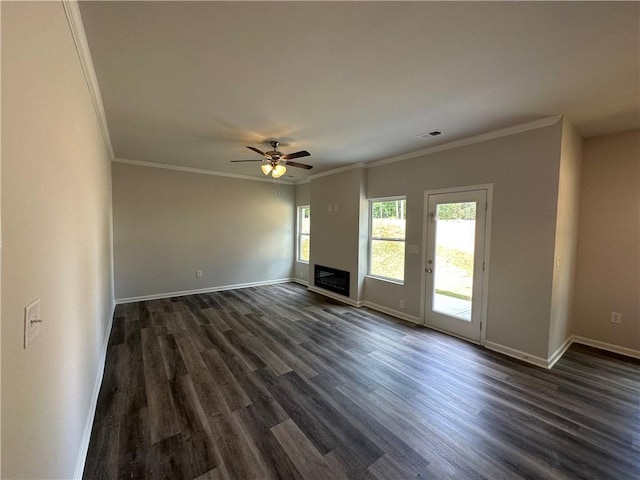 unfurnished living room featuring ceiling fan, dark hardwood / wood-style floors, and ornamental molding