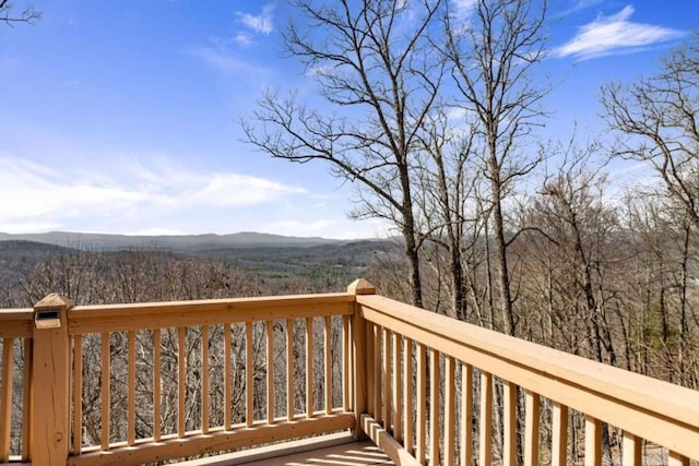 wooden deck featuring a mountain view