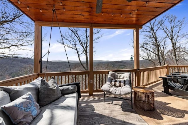 wooden terrace featuring outdoor lounge area