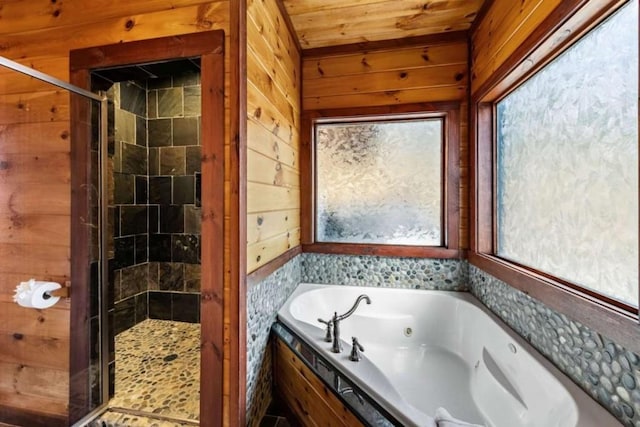 full bathroom featuring wooden ceiling, wooden walls, a stall shower, and a whirlpool tub
