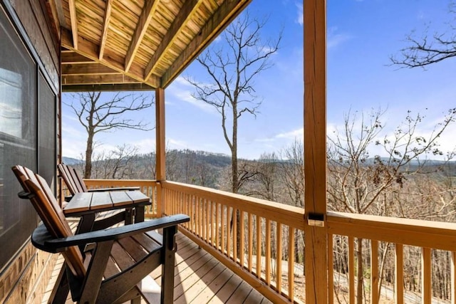deck featuring a forest view
