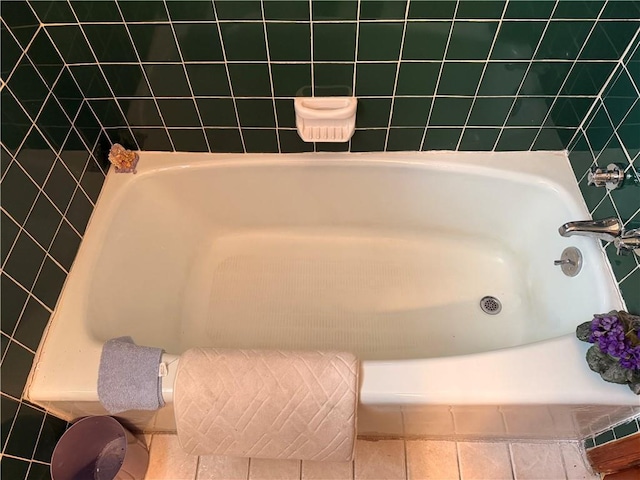 bathroom featuring a bath and tile patterned floors
