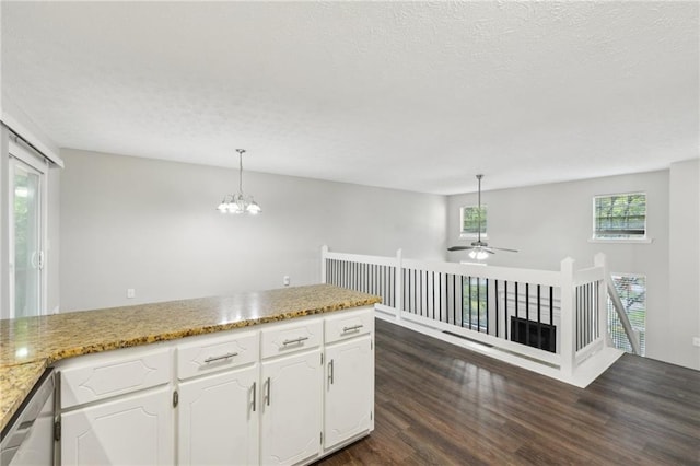2920 Cushing Ct, Jonesboro, GA 30236 - kitchen featuring dark wood-style floors, a textured ceiling, white cabinetry, ceiling fan, and a chandelier