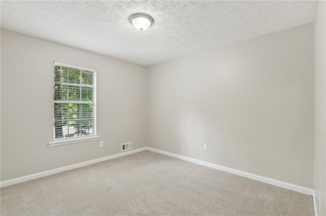 2920 Cushing Ct, Jonesboro, GA 30236 - unfurnished room with light colored carpet, a textured ceiling, and baseboards