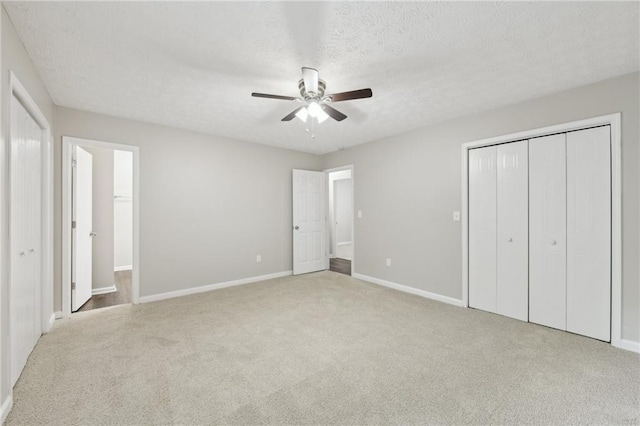 2920 Cushing Ct, Jonesboro, GA 30236 - unfurnished bedroom featuring carpet, baseboards, a textured ceiling, ceiling fan, and a closet