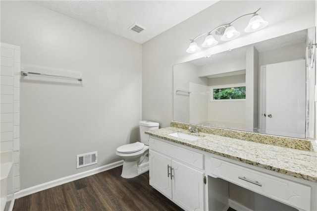 2920 Cushing Ct, Jonesboro, GA 30236 - full bathroom featuring wood finished floors, vanity, toilet, baseboards, and a shower