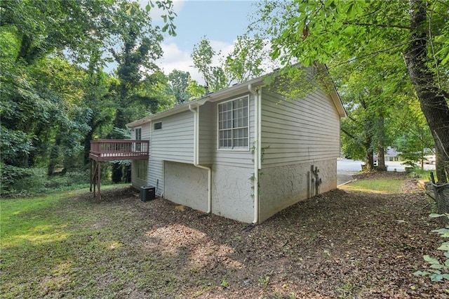 2920 Cushing Ct, Jonesboro, GA 30236 - view of home's exterior featuring a wooden deck and central AC