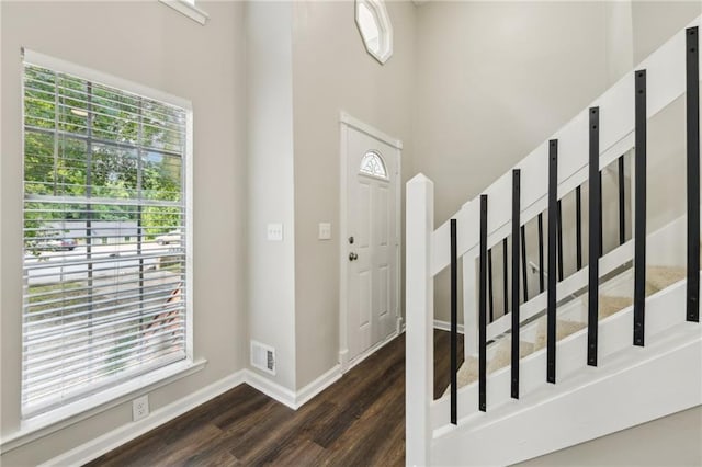 2920 Cushing Ct, Jonesboro, GA 30236 - entrance foyer featuring dark wood-style floors, baseboards, a high ceiling, and stairway