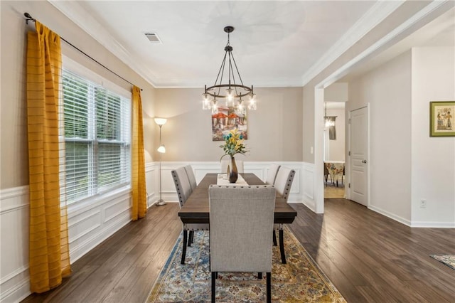 4266 Suwanee Brook Ct, Buford, GA 30518 - dining space featuring plenty of natural light, a chandelier, dark wood-style floors, a wainscoted wall, and crown molding