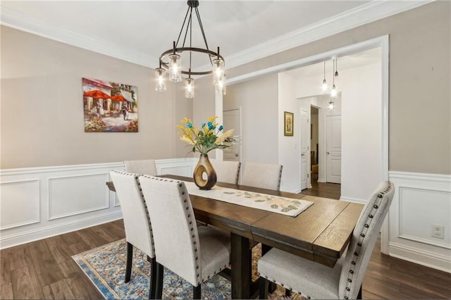 4266 Suwanee Brook Ct, Buford, GA 30518 - dining area with a chandelier, dark wood-type flooring, a decorative wall, wainscoting, and crown molding