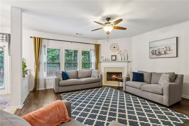 4266 Suwanee Brook Ct, Buford, GA 30518 - living area with ceiling fan, wood finished floors, a lit fireplace, and baseboards