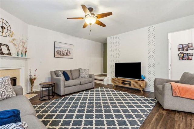 4266 Suwanee Brook Ct, Buford, GA 30518 - living room featuring ceiling fan, wood finished floors, a fireplace, and baseboards