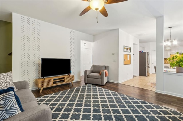 4266 Suwanee Brook Ct, Buford, GA 30518 - living room with wood finished floors, ceiling fan, and baseboards