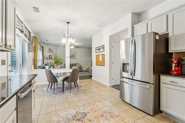 4266 Suwanee Brook Ct, Buford, GA 30518 - kitchen with appliances with stainless steel finishes, light tile patterned floors, a ceiling fan, pendant lighting, and white cabinetry