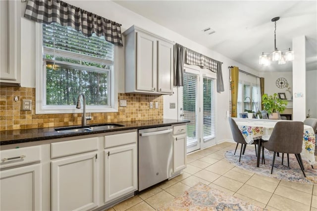 4266 Suwanee Brook Ct, Buford, GA 30518 - kitchen featuring stainless steel dishwasher, a sink, light tile patterned flooring, and decorative backsplash