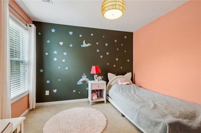 4266 Suwanee Brook Ct, Buford, GA 30518 - bedroom featuring multiple windows, an accent wall, light colored carpet, and baseboards