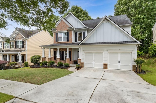4266 Suwanee Brook Ct, Buford, GA 30518 - craftsman-style home featuring board and batten siding, driveway, covered porch, and brick siding