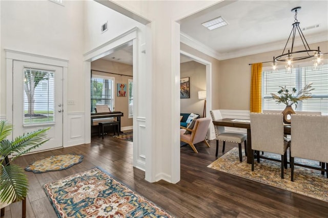 4266 Suwanee Brook Ct, Buford, GA 30518 - dining room with dark wood-type flooring, ornamental molding, and a chandelier