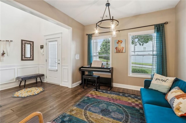 4266 Suwanee Brook Ct, Buford, GA 30518 - sitting room with wood finished floors and a chandelier