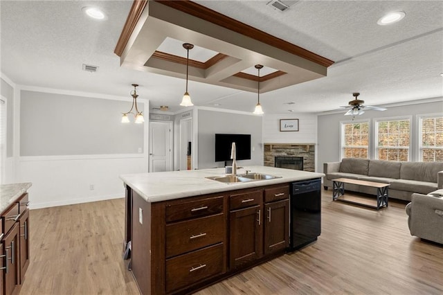 kitchen featuring black dishwasher, visible vents, open floor plan, crown molding, and a sink