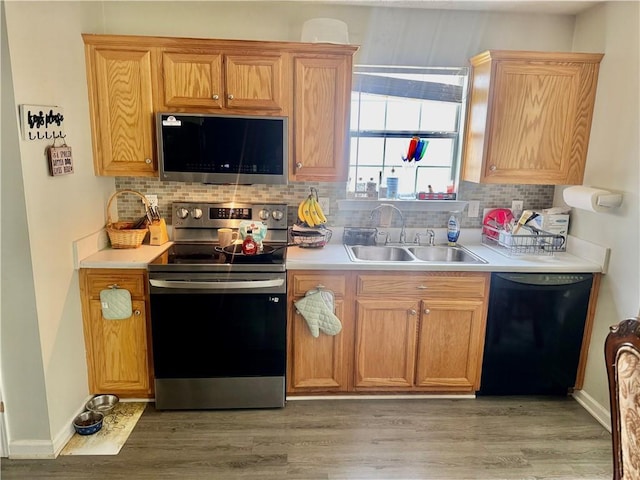 159 Misty Ridge Trl, Stockbridge, GA 30281 - kitchen with appliances with stainless steel finishes, a sink, backsplash, and light countertops