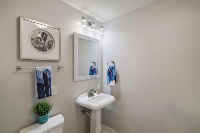 bathroom with sink and toilet