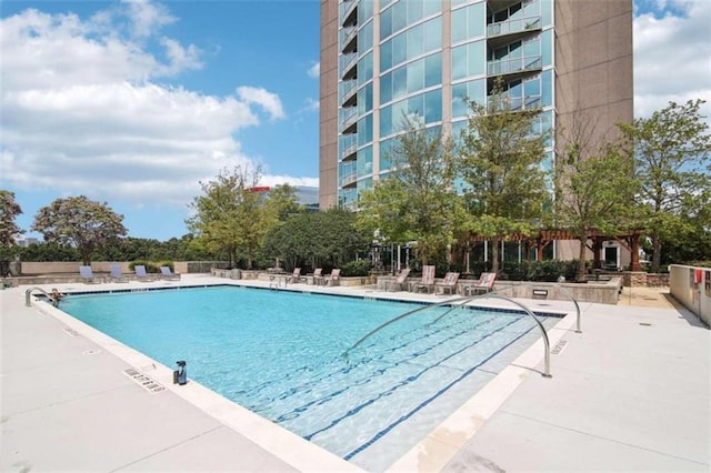 view of swimming pool with a patio area