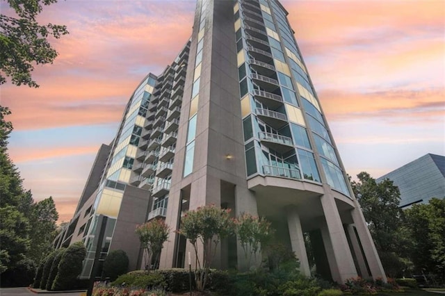 view of outdoor building at dusk