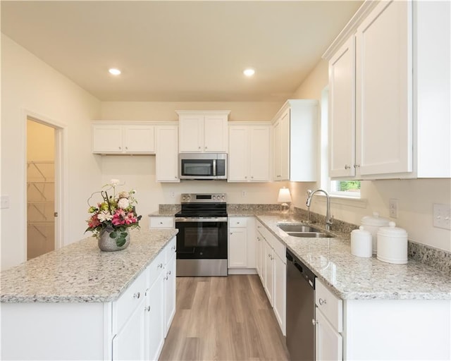 1577 Aiden Way Unit 39, Conyers, GA 30013 - kitchen featuring appliances with stainless steel finishes, a sink, white cabinets, and recessed lighting