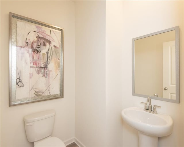 1577 Aiden Way Unit 39, Conyers, GA 30013 - bathroom featuring toilet, a sink, and baseboards
