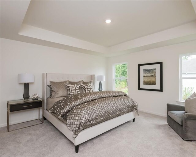 1577 Aiden Way Unit 39, Conyers, GA 30013 - carpeted bedroom featuring a raised ceiling, baseboards, multiple windows, and recessed lighting