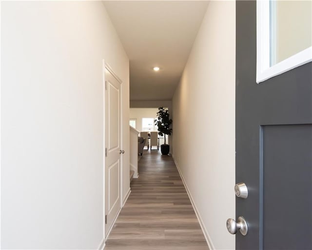 1577 Aiden Way Unit 39, Conyers, GA 30013 - hall with light wood finished floors, recessed lighting, and baseboards