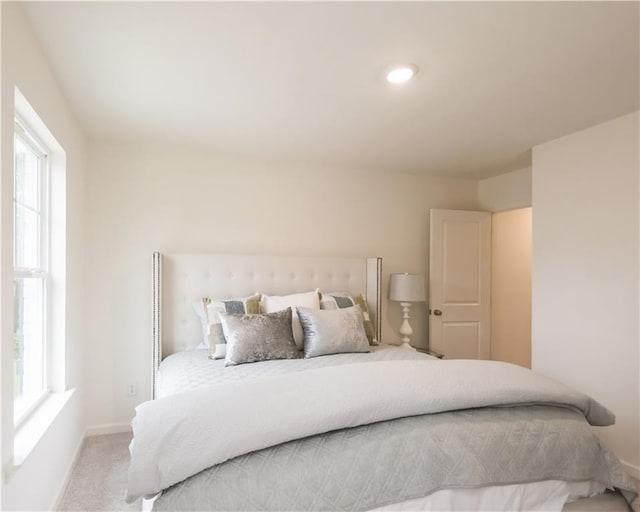 1577 Aiden Way Unit 39, Conyers, GA 30013 - carpeted bedroom with multiple windows, baseboards, and recessed lighting