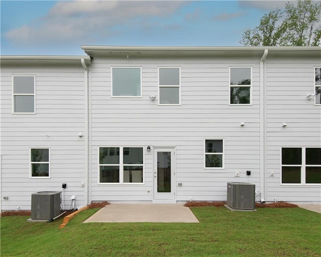 1577 Aiden Way Unit 39, Conyers, GA 30013 - back of property featuring central air condition unit, a patio, and a yard