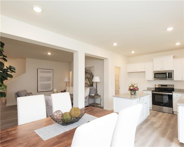 1577 Aiden Way Unit 39, Conyers, GA 30013 - dining area featuring light wood-style flooring, recessed lighting, and baseboards