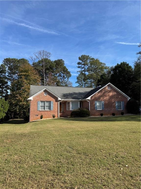 ranch-style house with a front yard