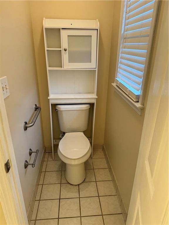 bathroom featuring tile patterned floors and toilet