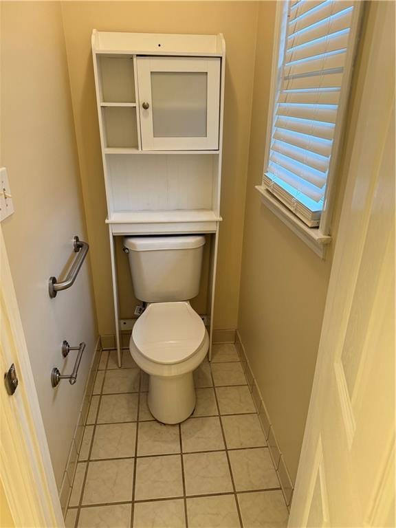 bathroom featuring tile patterned floors and toilet