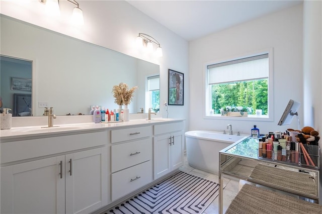 3518 Mount Blue Ave, Tucker, GA 30084 - bathroom featuring double vanity, a freestanding bath, and tile patterned floors