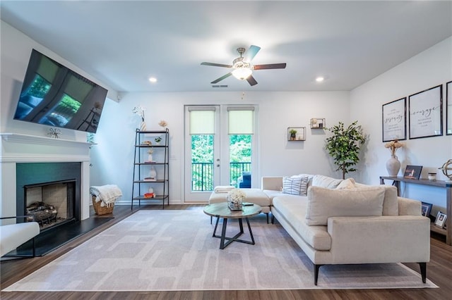 3518 Mount Blue Ave, Tucker, GA 30084 - living area with ceiling fan, wood finished floors, a fireplace with raised hearth, and recessed lighting