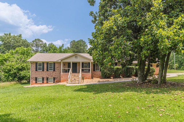 7928 S Giles Rd, Douglasville, GA 30135 - view of front of property with brick siding and a front lawn