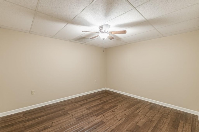 7928 S Giles Rd, Douglasville, GA 30135 - empty room with ceiling fan, a paneled ceiling, dark wood-type flooring, and baseboards