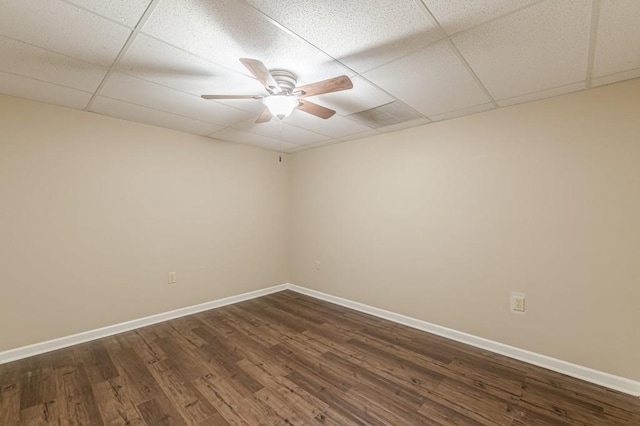 7928 S Giles Rd, Douglasville, GA 30135 - spare room with a ceiling fan, a paneled ceiling, baseboards, and dark wood-type flooring