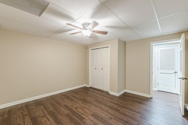 7928 S Giles Rd, Douglasville, GA 30135 - unfurnished bedroom with a paneled ceiling, dark wood finished floors, baseboards, a closet, and ceiling fan