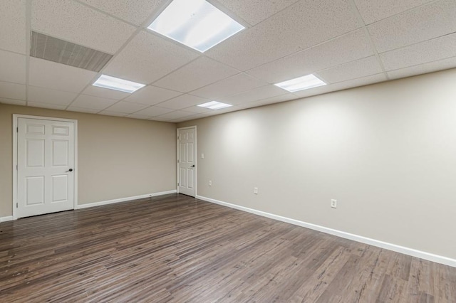 7928 S Giles Rd, Douglasville, GA 30135 - empty room with wood finished floors, baseboards, and a drop ceiling