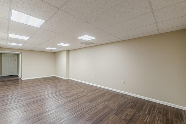 7928 S Giles Rd, Douglasville, GA 30135 - empty room with dark wood finished floors, a paneled ceiling, and baseboards