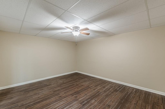 7928 S Giles Rd, Douglasville, GA 30135 - empty room with baseboards, a drop ceiling, a ceiling fan, and dark wood-style floors