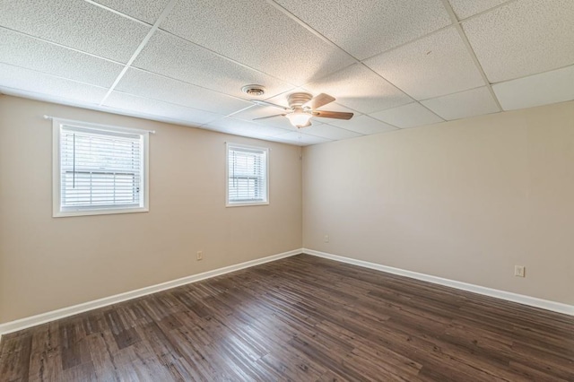 7928 S Giles Rd, Douglasville, GA 30135 - empty room with a paneled ceiling, a ceiling fan, baseboards, and dark wood finished floors