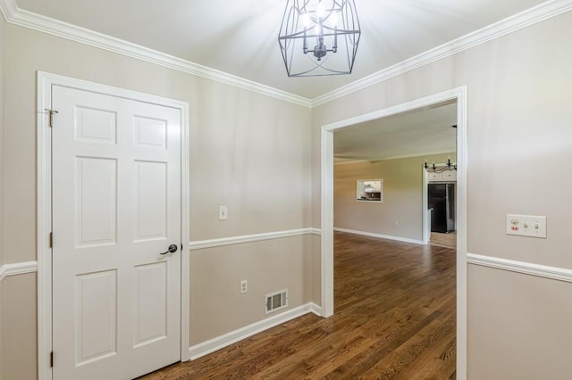 7928 S Giles Rd, Douglasville, GA 30135 - corridor featuring a chandelier, crown molding, wood finished floors, and baseboards